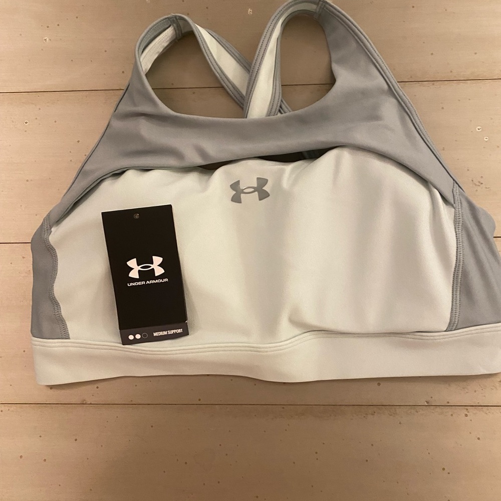 Under Armour workout bra. Comes from non-smoking home. NWOT attached.Brand new!